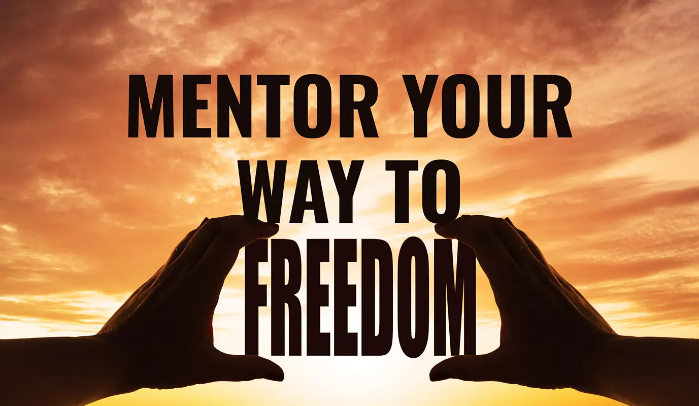 Silhouette of hands framing a sunset sky with the words “Mentor Your Way to Freedom,” symbolizing building freedom and success through mentorship.